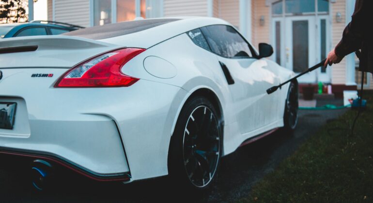 white porsche 911 parked near white house