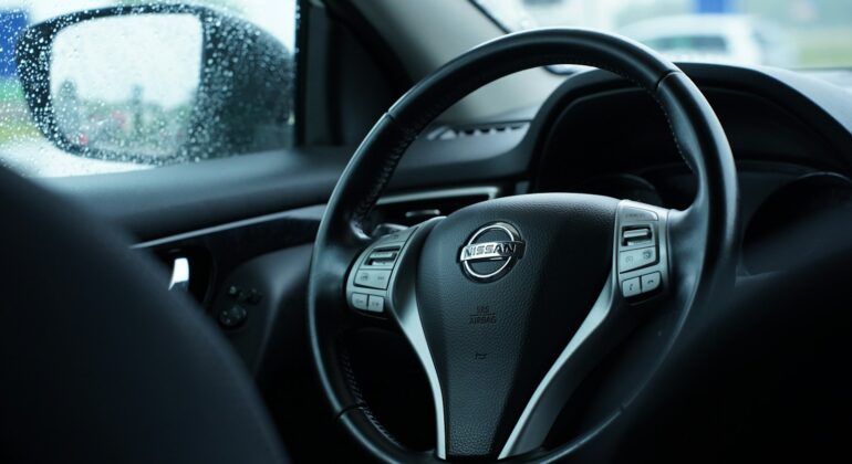 a steering wheel and dashboard of a vehicle